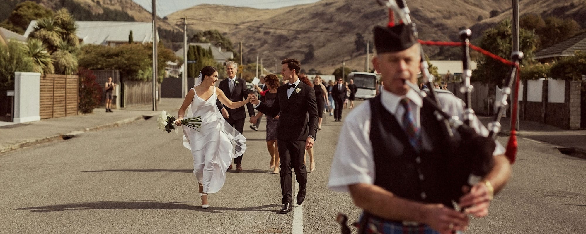 Wedding ceremony procession with bagpipe player